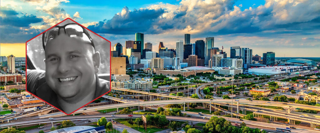 Senior SupplySight™ Sales Specialist Nick Freeman smiling in portrait framed in a red hexagon, overlaid on a vibrant cityscape of Houston, Texas.