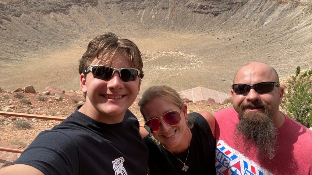 Nick Freeman and his family visiting a geographic place of interest.